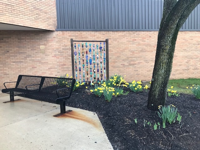 West Central school outside bead artwork and bench