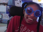 Girl wearing silly glasses